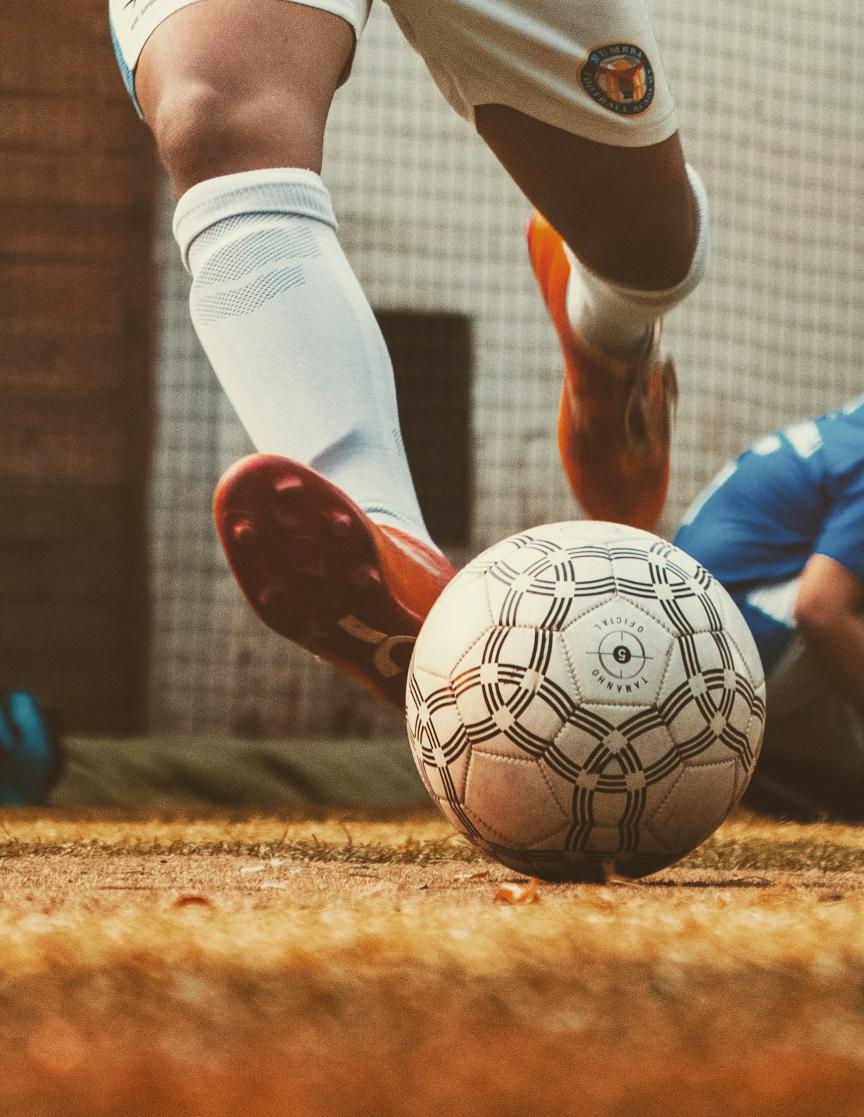 Soccer player kicking the ball