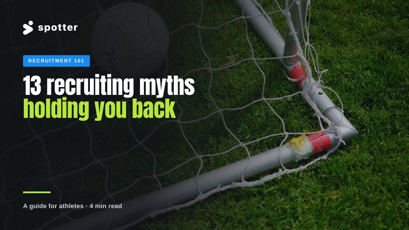 A soccer ball resting in the corner of a goal net on green grass.