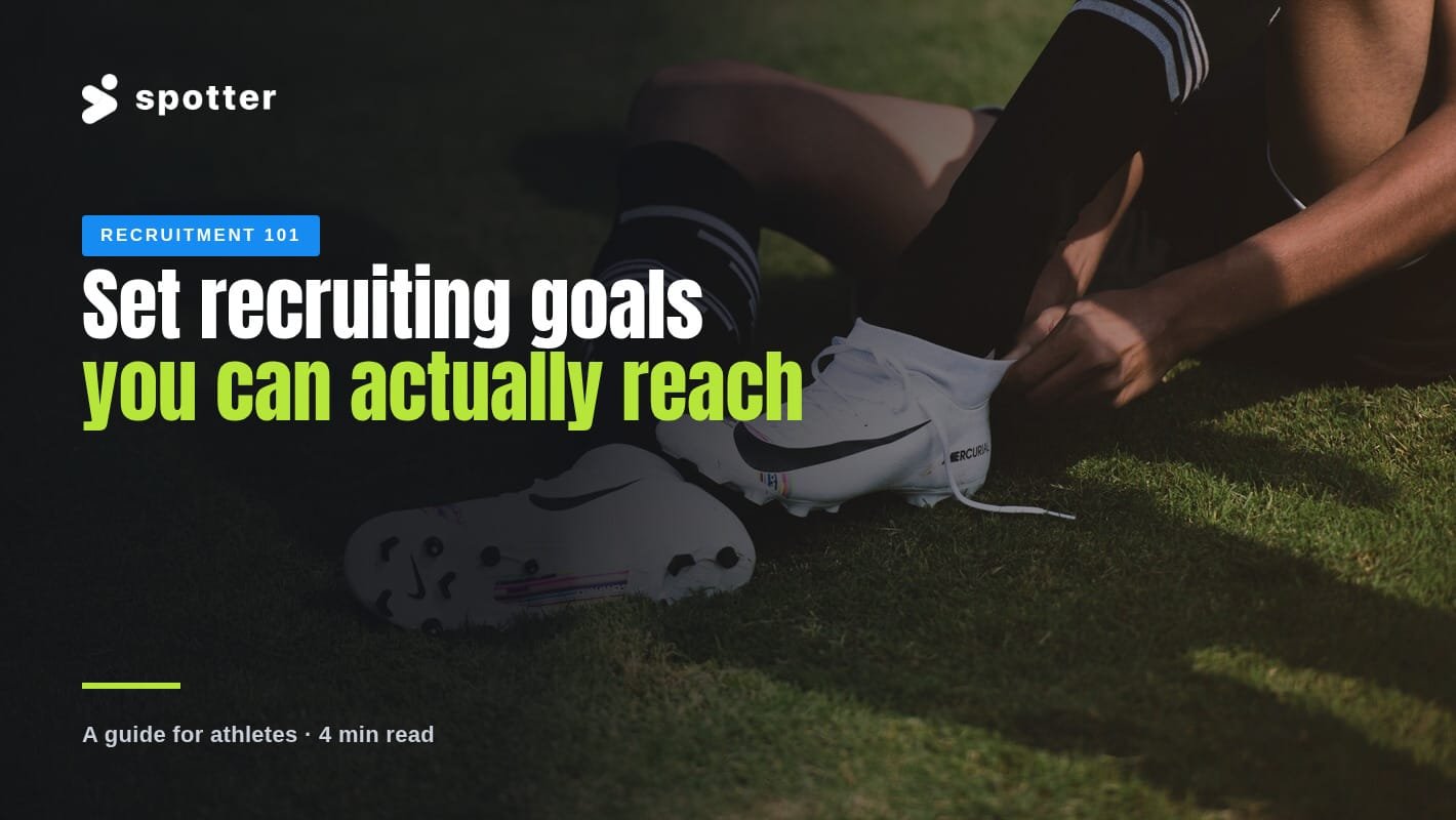 A soccer player sits on the grass tying their cleats before training.
